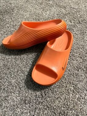 Nike Women’s Orange Ribbed Slide Sandals with Metallic Swoosh